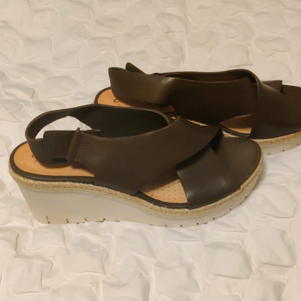 Brand new wedge Clarke's sandals. Perfect accessory for any outfit.
